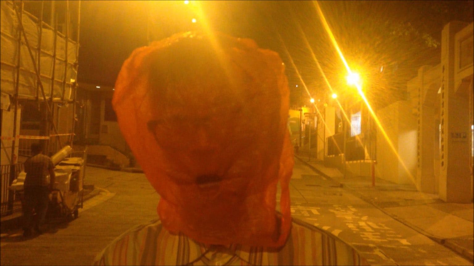 Man with Red Plastic Bag